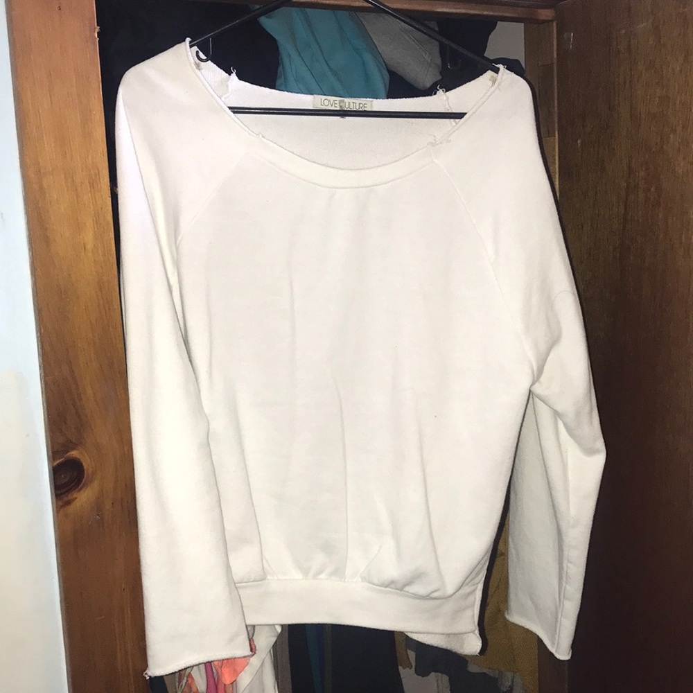 Back cut out, heart shaped sweater